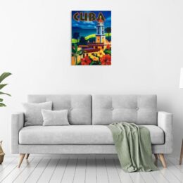 Tableau vintage Cuba accroché sur un mur avec un canapé et un plaid dans une maison
