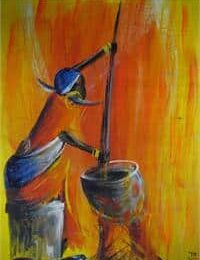 Femme africaine pilant le blé