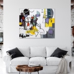 peinture toile abstraite Kandinsky sur un mur blanc dans un salon moderne au dessus d'un canapé blanc aux coussins noirs.