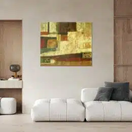 tableau abstrait marron et beige sur un mur beige au dessus d'un canapé moderne blanc en cuir.