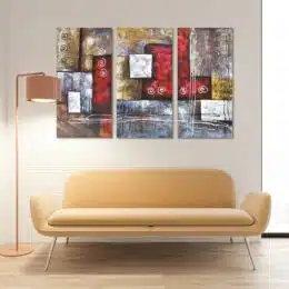 tableau triptyique abstrait rouge gris marron au dessus d'un canapé jaune dans un salon blanc simple et minimaliste.