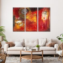 tableau triptyque toile abstrait rouge dans un intérieur cosy et moderne aux tons blancs, beiges et clairs.