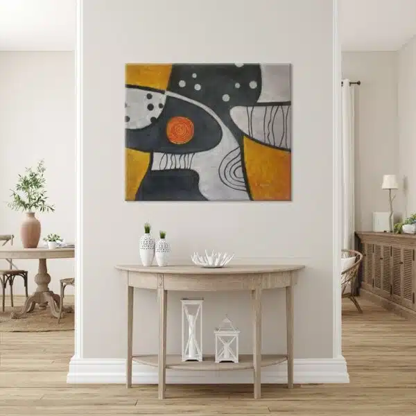 peinture abstraite orange gris noir dans un intérieur moderne aux tons blancs et boisés.