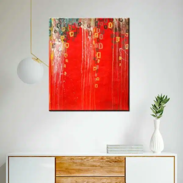 Peinture abstraite rouge et orange, bonne qualité et très original. Accrochée sur le mur au-dessus d'une table avec une vase dans un salon