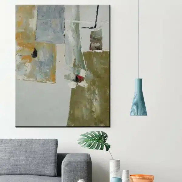 Peinture abstraite grise. Bonne qualité, original, accrochée sur un mur au dessus d'un canapé dans une maison