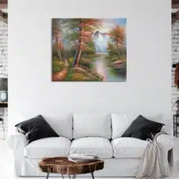 Tableau paysage montagne automne accroché sur un mur avec un canapé et une table dans une maison