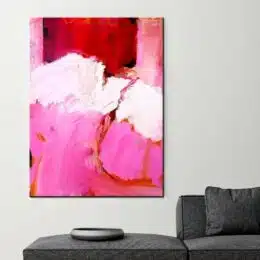 Peinture abstraite rose et blanc. Bonne qualité, original, accrochée sur un mur au-dessus d'un canapé dans une maison
