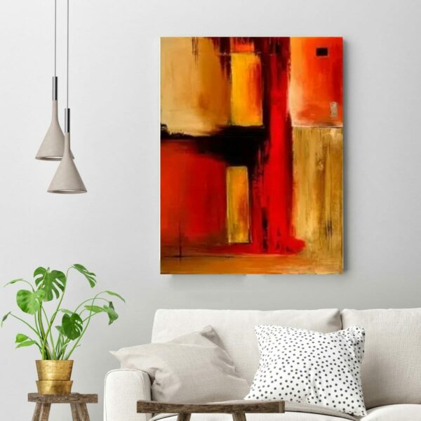 Tableau abstrait orange jaune peinture abstraite. Accrochée sur un mur avec un canapé dans un salon