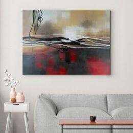 Tableau abstraite rouge noir gris accroché sur un mur avec un canapé dans une maison