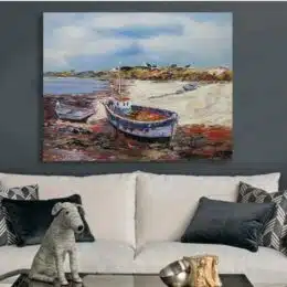 Peintures sur toile de paysages marins, montée sur châssis en bois. Accroché sur un mur avec un canapé dans un salon