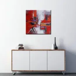 Peinture abstraite gris rouge foncé huile sur toile. Bonne qualité, très original, accrochée sur un mur au-dessus d'une table dans une maison.