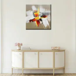 Tableau xxl beige blanc orange jaune, art-déco, bonne qualité, très original, accrochée sur un mur au-dessus d'une table dans une maison.