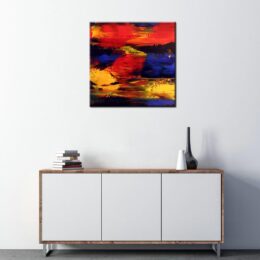 Peinture abstraite jaune orange bleu. Bonne qualité, très original accrochée sur un mur au-dessus d'une table en mélamine dans une maison.