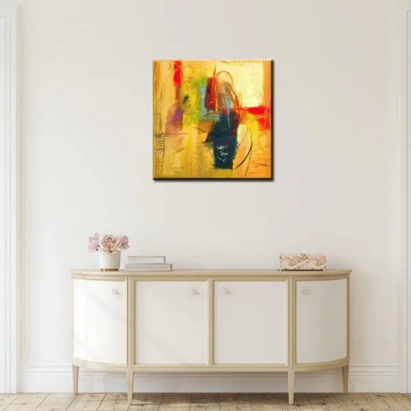Peinture toile abstraite jaune noire orange carrée. Bonne qulaité, très original accrochée sur un mur au-dessus d'une table dans une maison