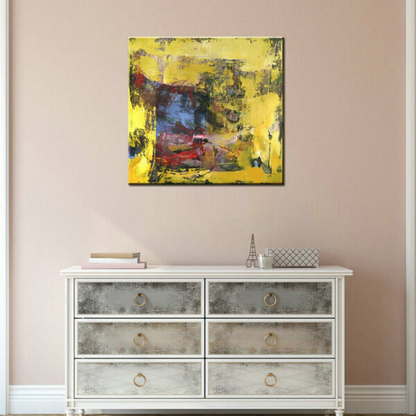 Peinture toile abstraite jaune bleue, bonne qualité très original accrochée sur un mur au-dessus d'une table dans un salon.