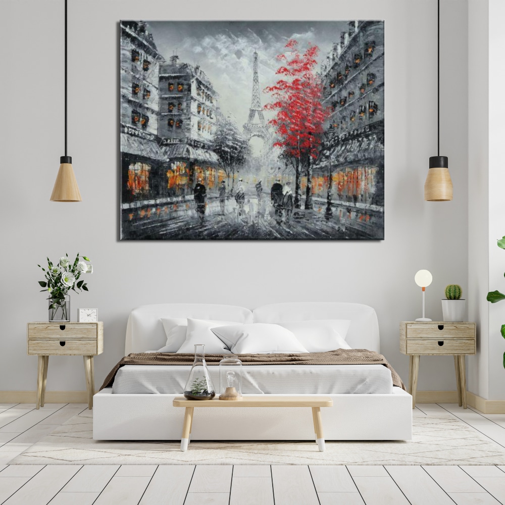 tableaux de paris en automne avec arbre rouge dans un salon avec un canape blanc