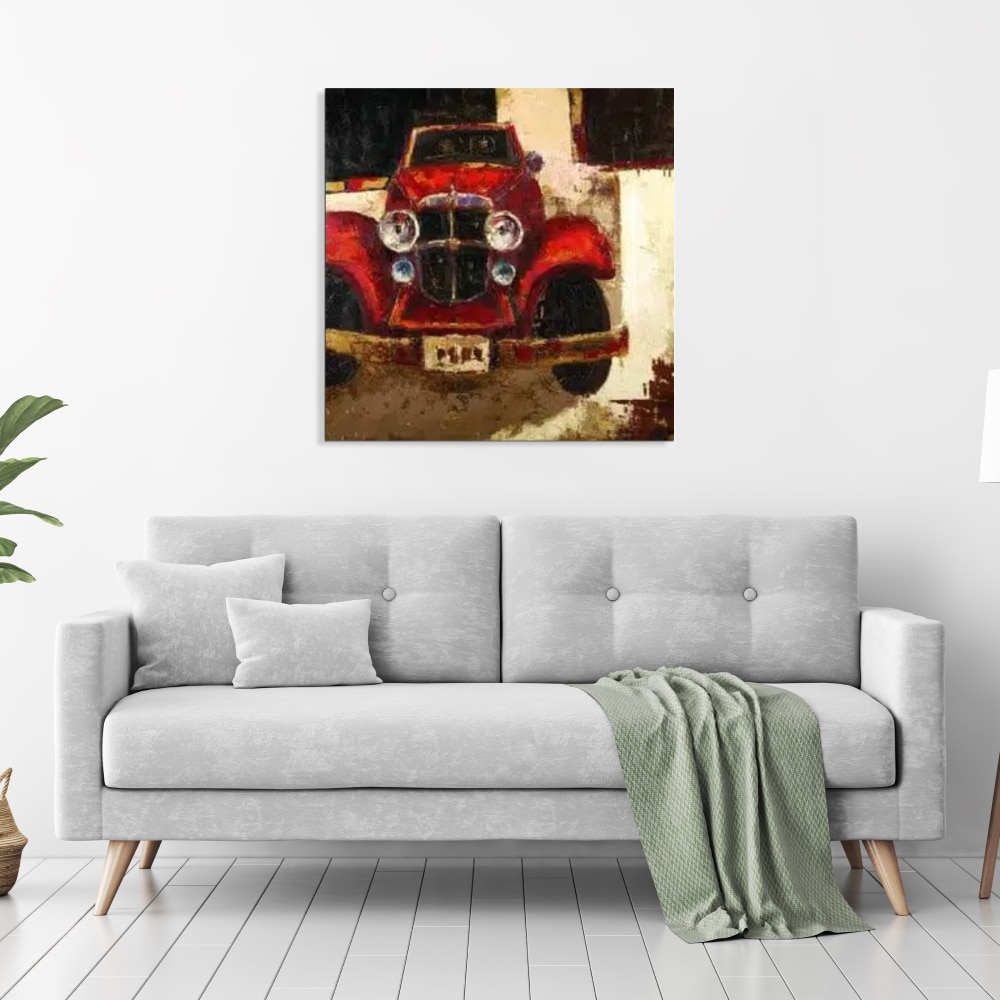 Peinture moderne retro automobile Tableau d'une voiture de collection rouge des années 40, accroché au-dessus d'un canapé gris avec un plaid vert